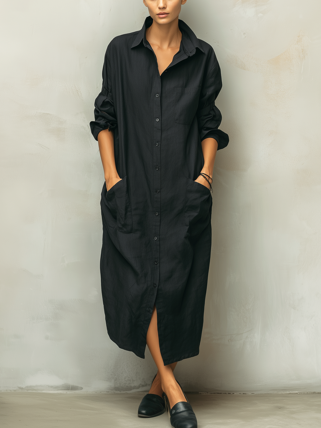 Women's black long sleeve button-down midi dress. A versatile, relaxed-fit shirt dress perfect for everyday wear.