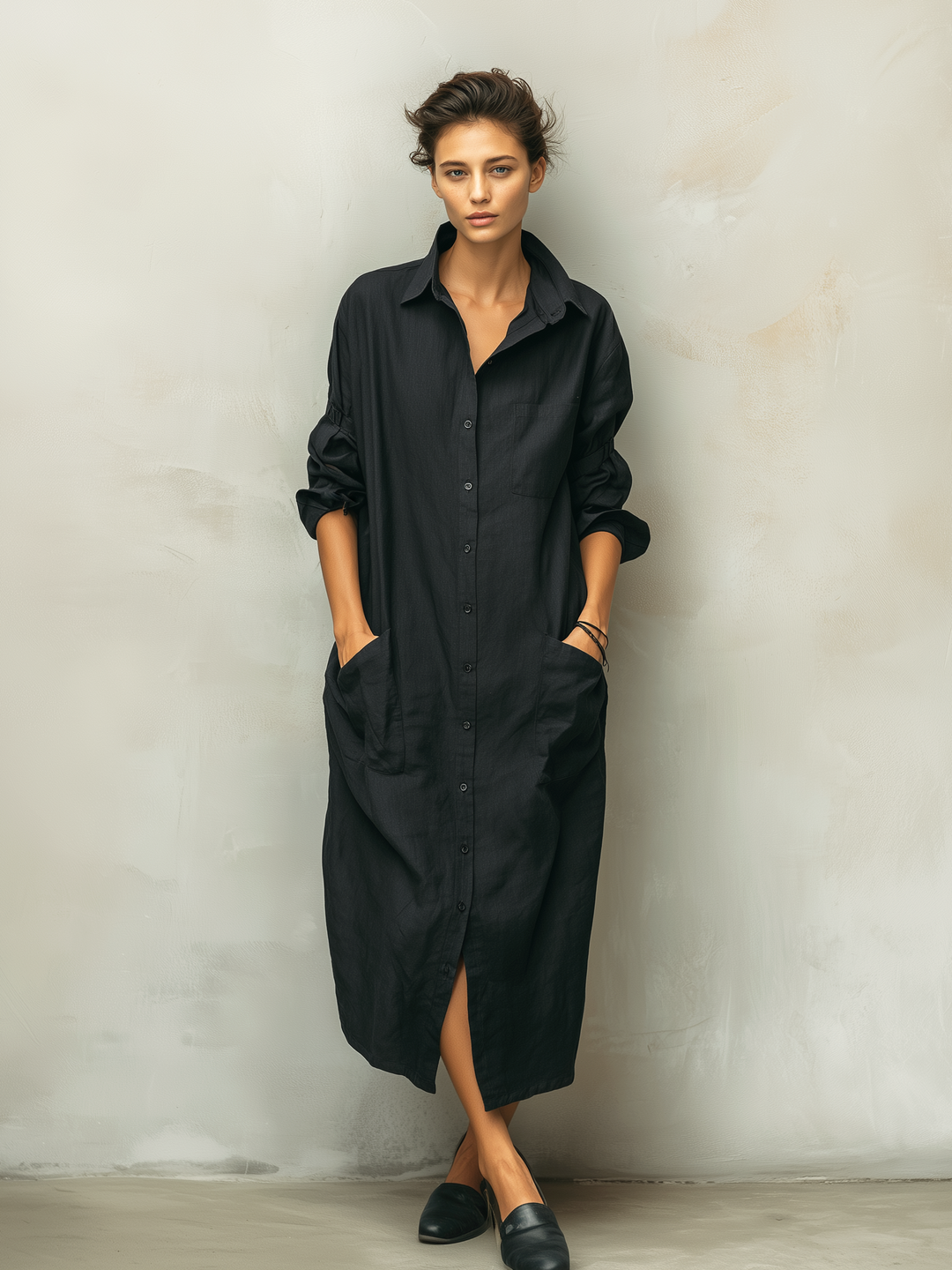 Elegant women's long sleeve midi dress with functional buttons & relaxed fit. A stylish everyday black dress.