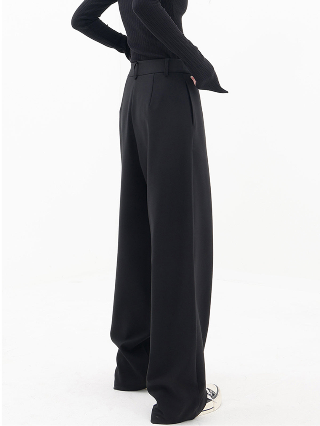 Stylish women's Monroe Baggy Trousers, soft fabric, relaxed wide leg, and asymmetric design in black.