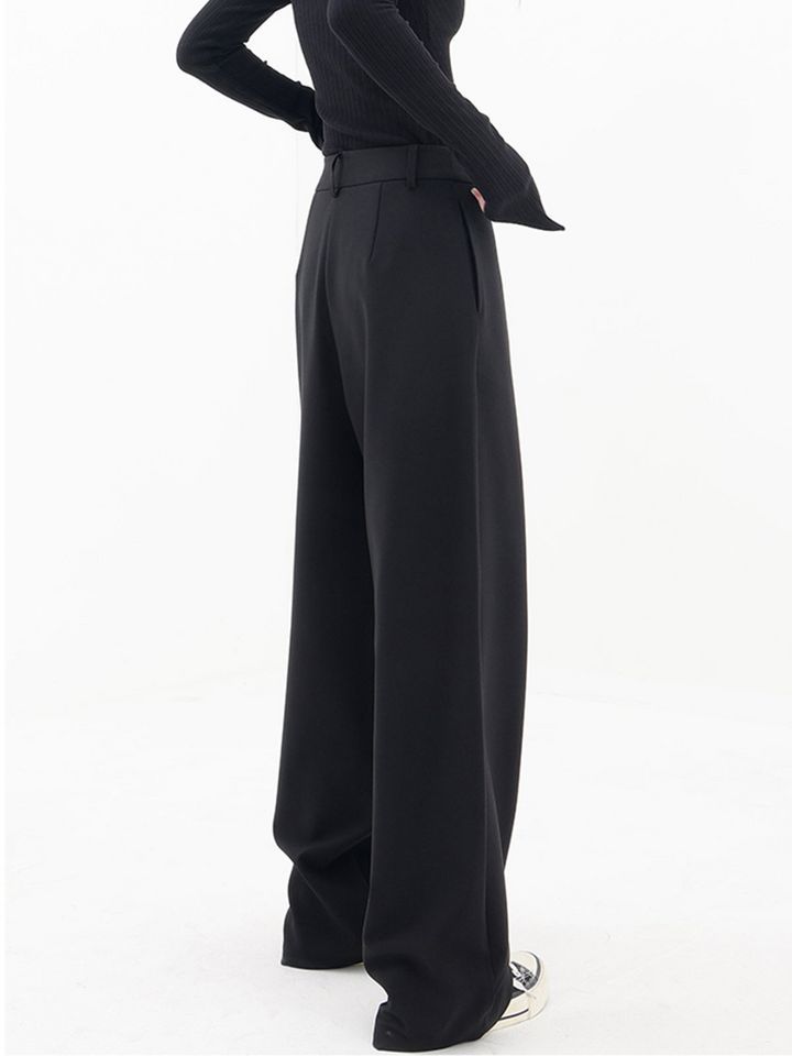 Stylish women's Monroe Baggy Trousers, soft fabric, relaxed wide leg, and asymmetric design in black.