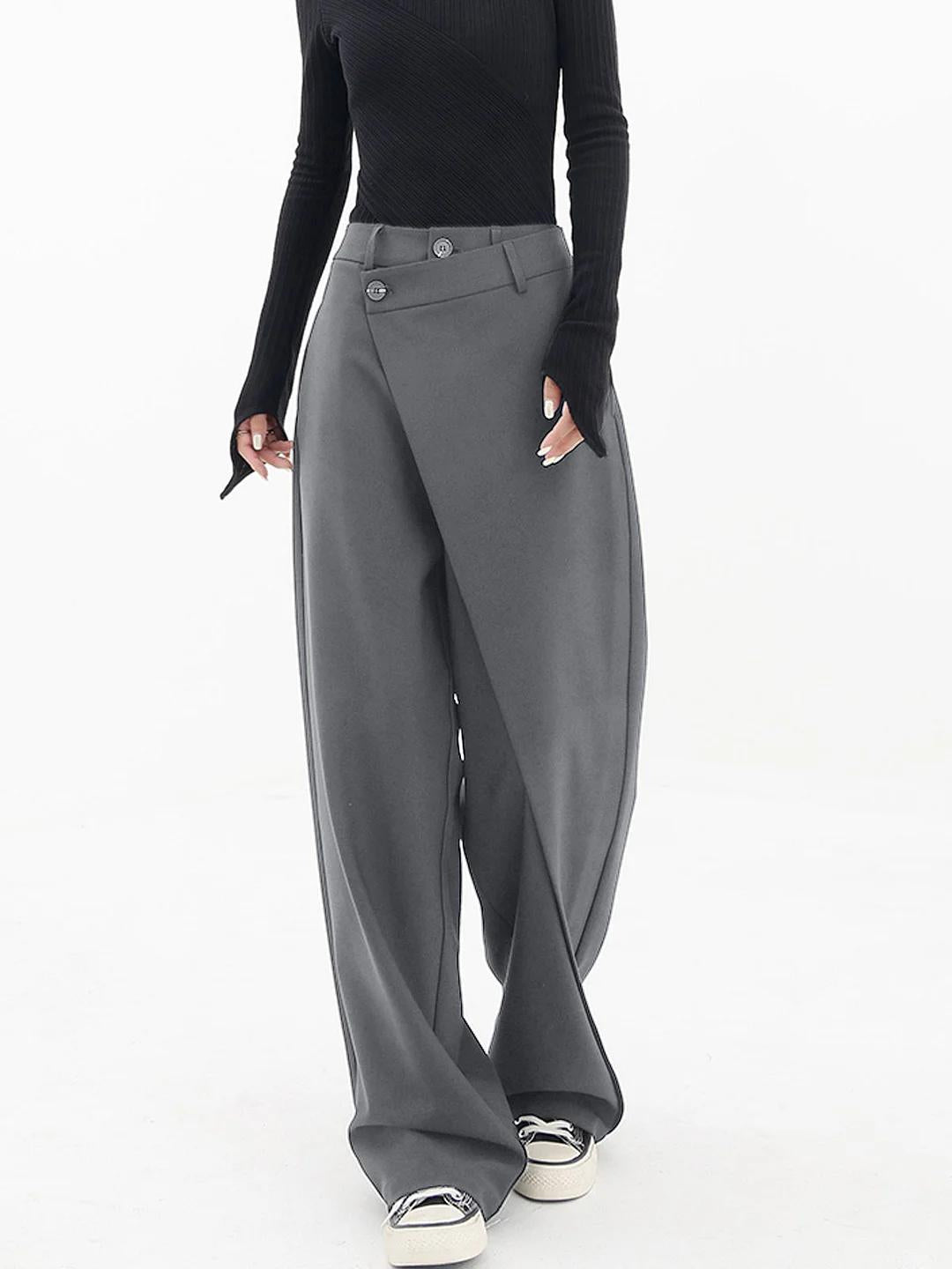 Versatile black women's Monroe Baggy Trousers, relaxed wide leg, asymmetric design for casual or semi-casual wear.