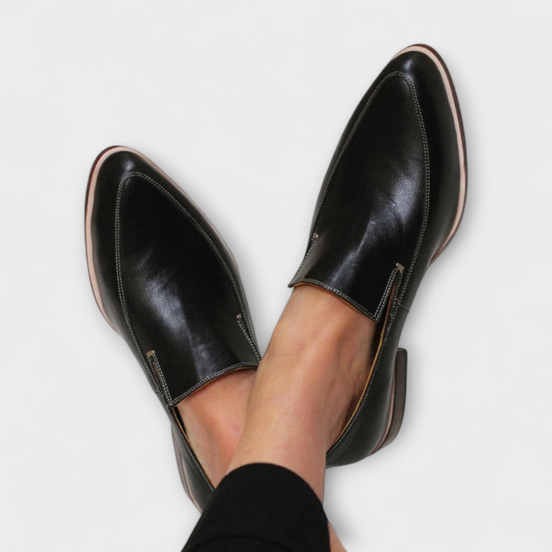 Women's black orthopedic loafers. Slip-on design for all-day comfort, arch support, and versatile everyday style.