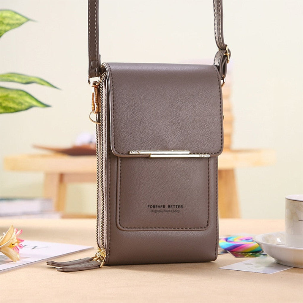 Versatile women's small purse, works as a clutch or crossbody, with touchscreen access for your phone.