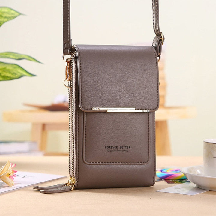 Versatile women's small purse, works as a clutch or crossbody, with touchscreen access for your phone.