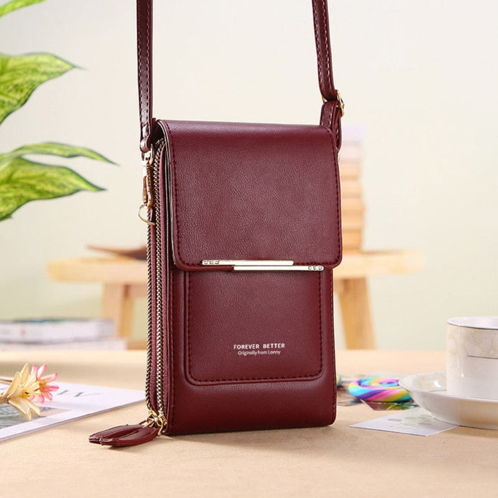 Chic travel phone shoulder bag for women with an integrated touchscreen compartment; a practical small purse.