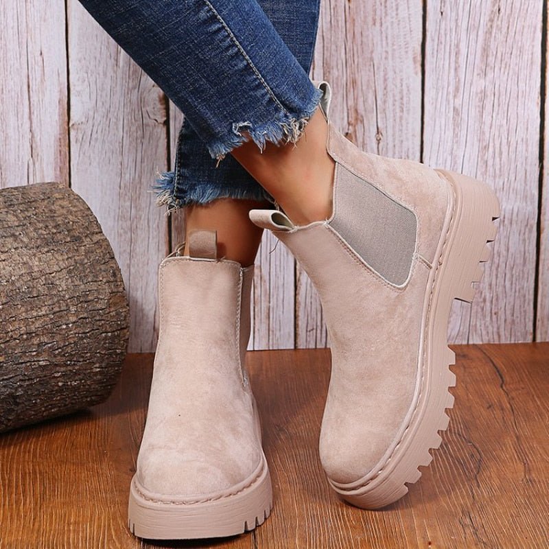 Women's black platform Chelsea boots with elastic sides & pull-on design for effortless modern streetwear style.