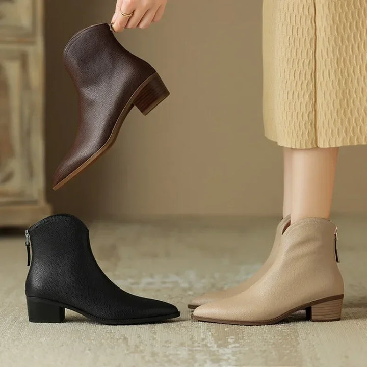 Modern women's pointed toe slip-on ankle boots, low heel, designed for chic office wear and versatile fashion.