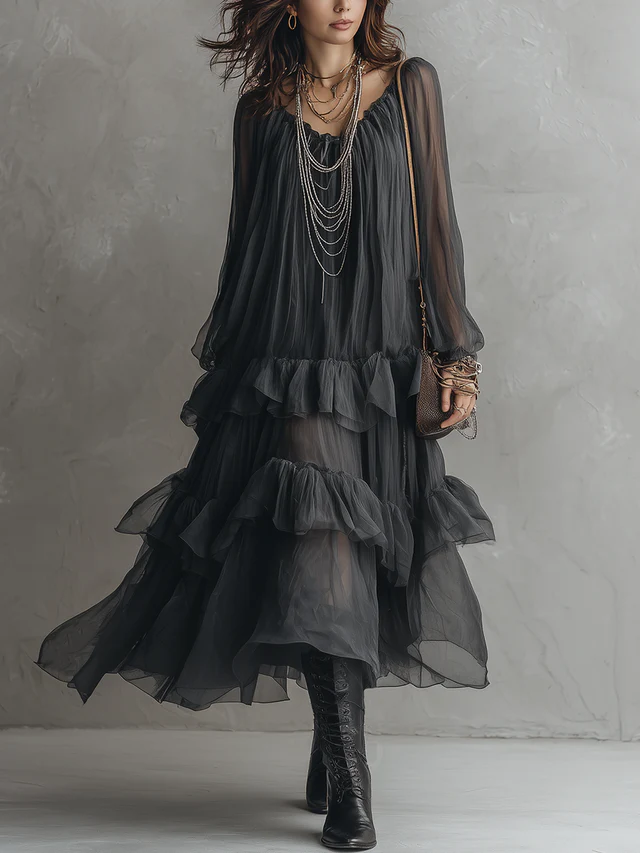 Women's black sheer tiered maxi dress with V-neck & ruffles. Elegant flowy boho style for summer evenings.