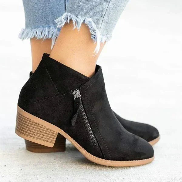 Chic women's pointed toe ankle boots with sturdy block heel and practical side zip closure. Ideal for daily wear.