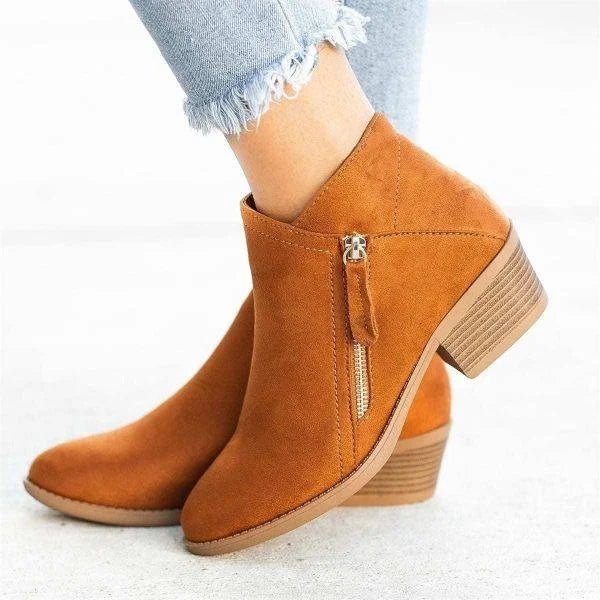 Comfortable women's ankle boots for fall & winter. Features a block heel, side zip, and stylish pointed toe design.