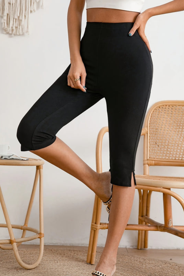Fashionable women's slim fit cropped pants in black, featuring a stretch design for all-day comfort and style.
