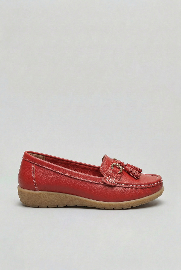 Close-up of comfortable women's slip-on loafers, highlighting cushioning & casual footwear design.