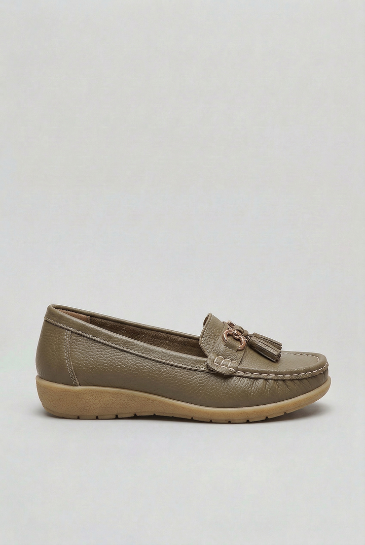 Side profile of comfortable women's slip-on loafers, a cushioned flat shoe perfect for everyday.