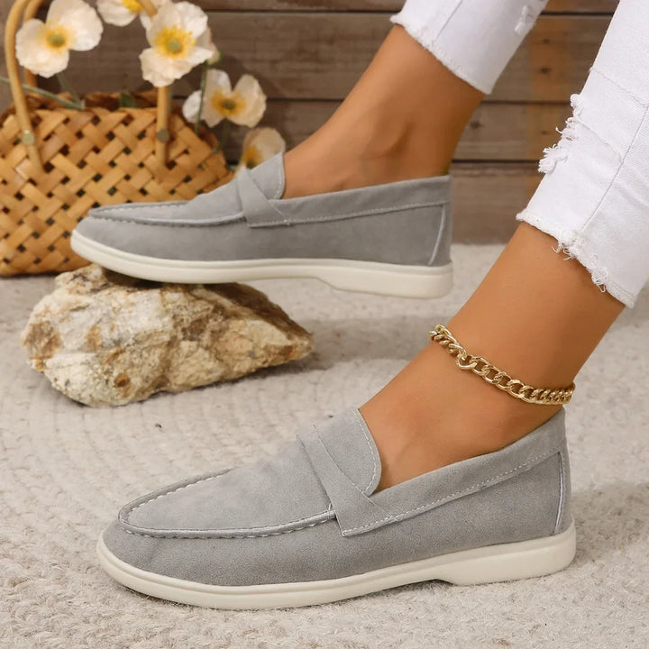 Women's black slip-on loafers with cushioned insole, perfect for office & casual wear.