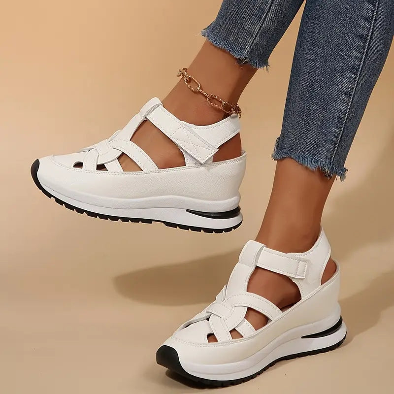 Stylish women's white platform sandals featuring cutout straps & open toe, ideal for casual summer wear.