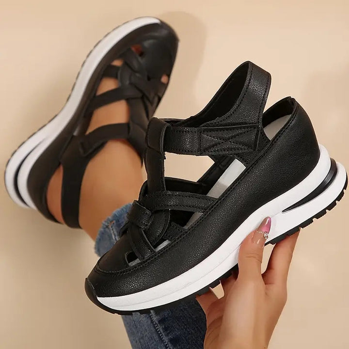 White women's comfortable platform sandals with an open toe and unique cutout strap design for summer fashion.