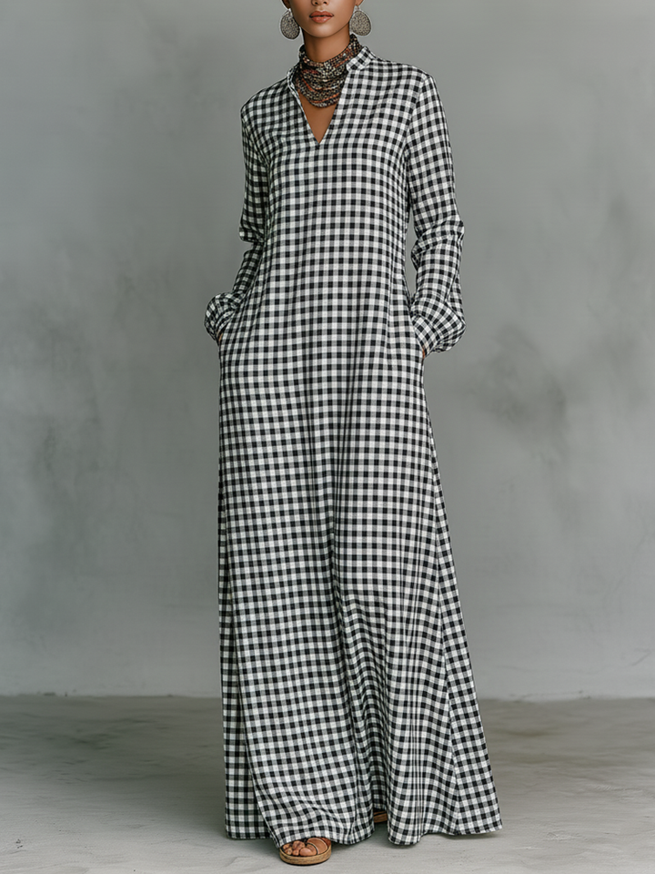 Women's black & white gingham check maxi dress with V-neck, long sleeves. Casual, flowy A-line for spring/summer.
