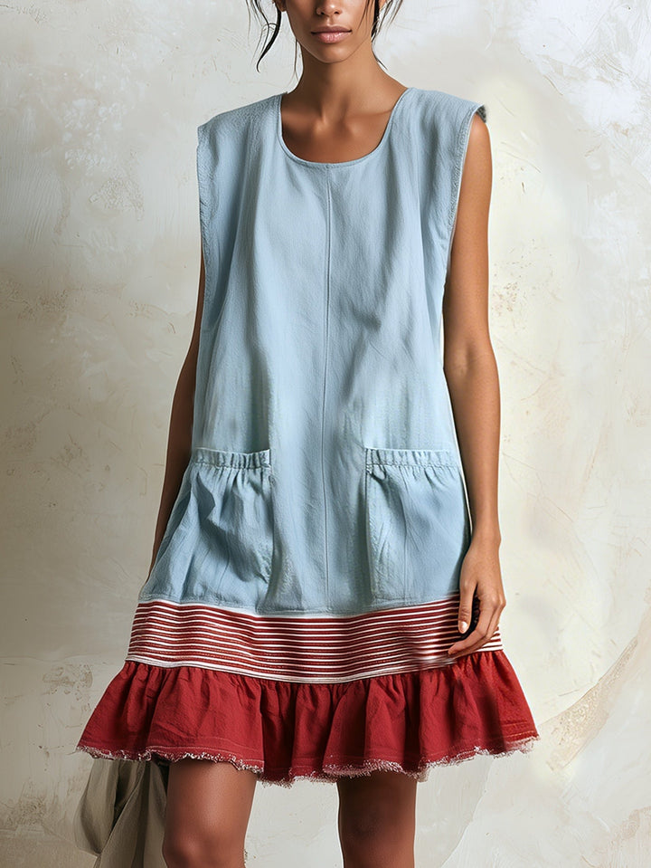 Women's blue ruffle tiered mini dress with white contrast hem. Sleeveless summer casual dress.