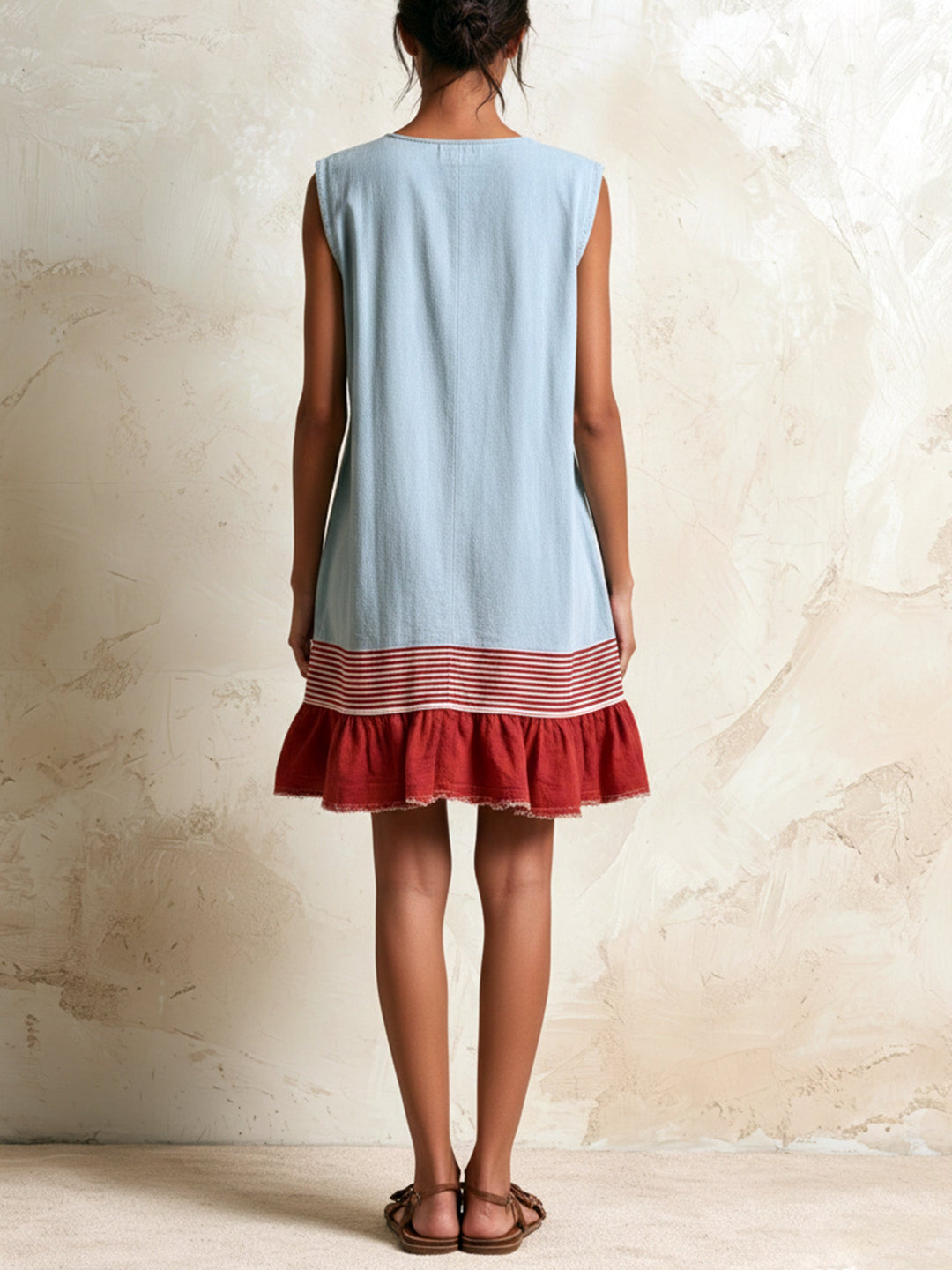 Women's casual blue mini dress. Ruffle tiered design with white contrast hem. Summer fashion, boho style.