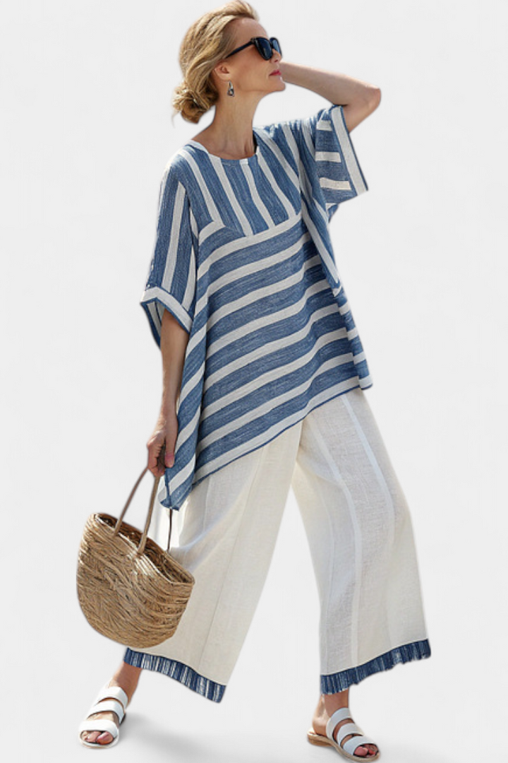 Relaxed fit women's blue striped batwing top and wide leg pant set. Comfortable two-piece casual summer outfit.