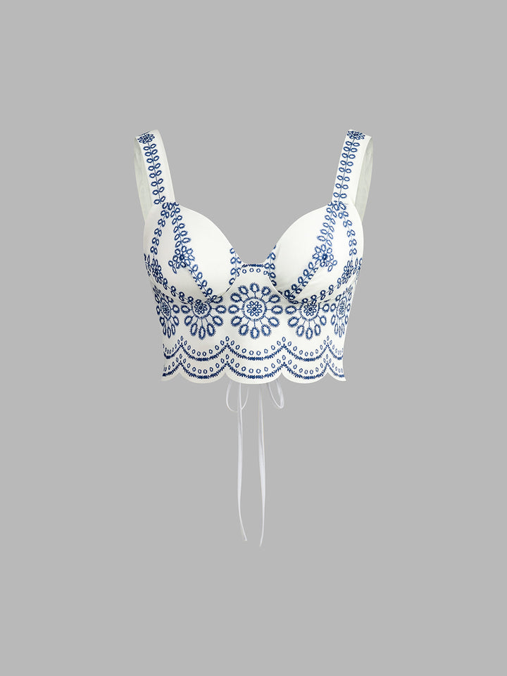 Stylish women's printed two-piece skirt set with sleeveless top & tie-back detail. Ideal for casual spring & summer fashion.