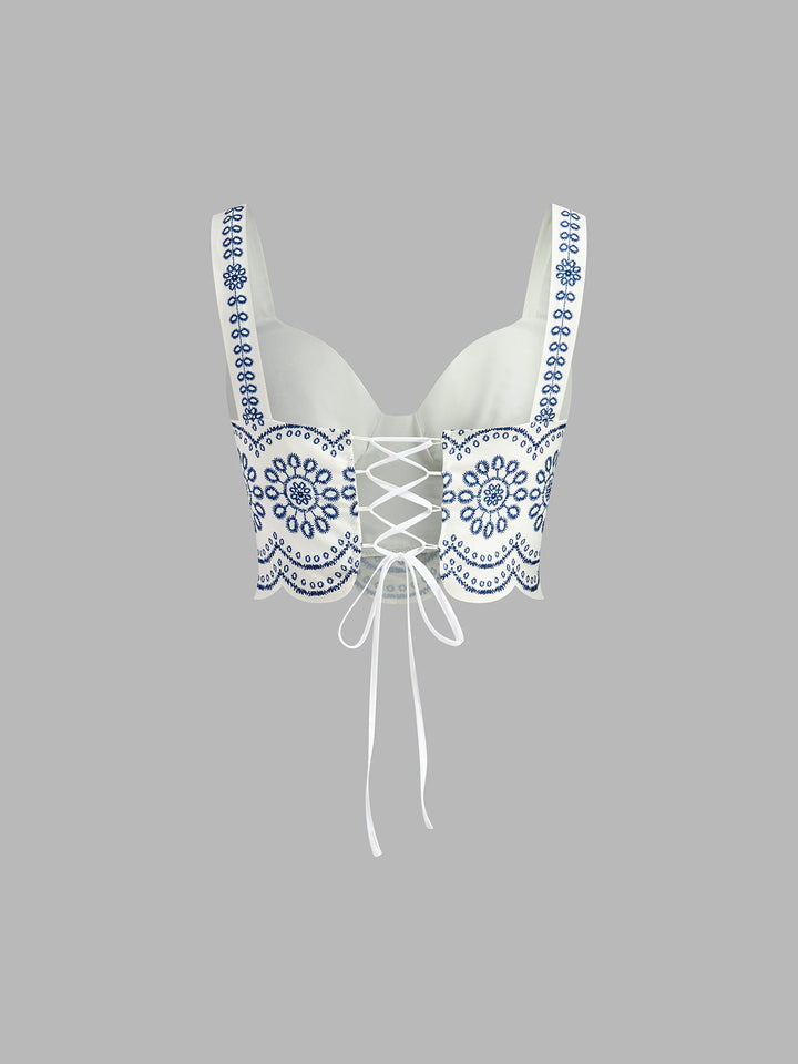 Blue & white printed sleeveless skirt set for women, featuring a chic top & matching skirt. Great for beach or spring casual.