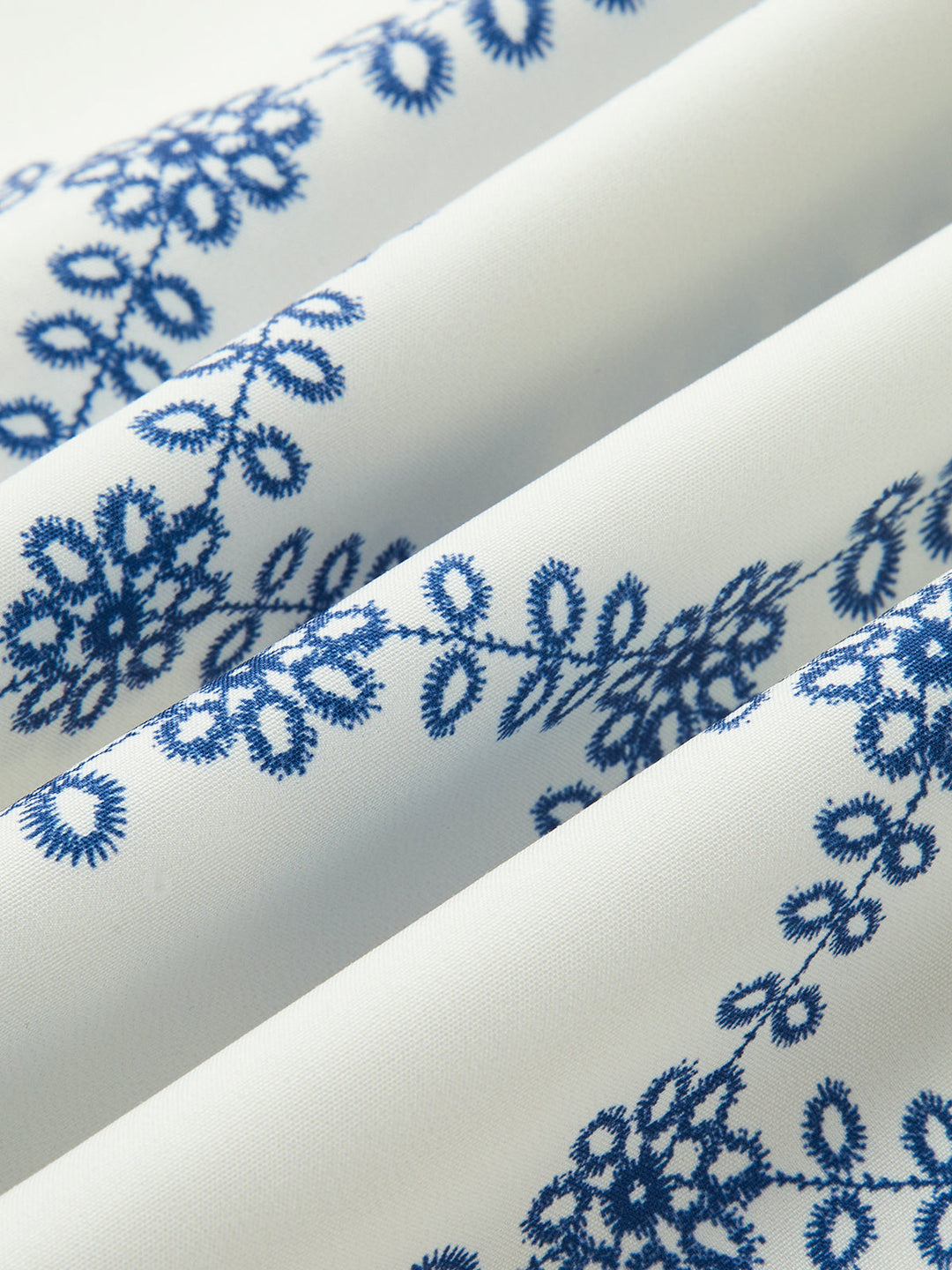 Comfortable women's blue & white printed two-piece skirt set. Sleeveless top & regular fit skirt for casual summer wear.