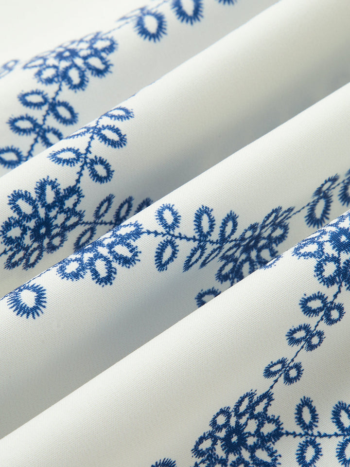Comfortable women's blue & white printed two-piece skirt set. Sleeveless top & regular fit skirt for casual summer wear.