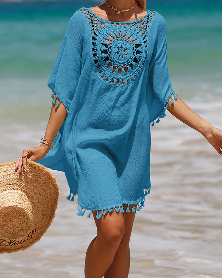 Stylish women's beachwear cover-up with tassels, a bohemian summer fashion essential for your next vacation.