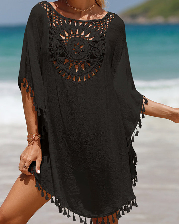 Elegant women's bohemian beach cover-up with tassels, adding a stylish loose fit layer to any summer swimwear.