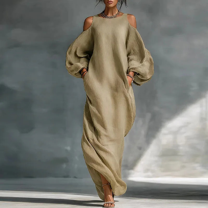 Relaxed fit women's bohemian maxi dress, featuring cold shoulder & long sleeves. Flowy casual elegant summer/fall attire.