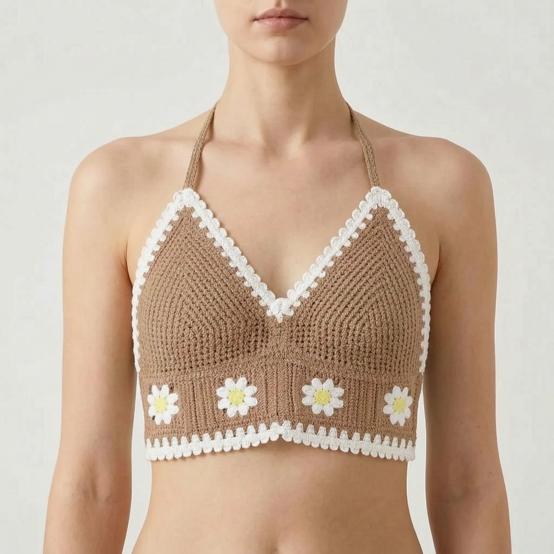 Close-up: Intricate crochet floral pattern on women's Bohemian halter crop top, perfect for summer.