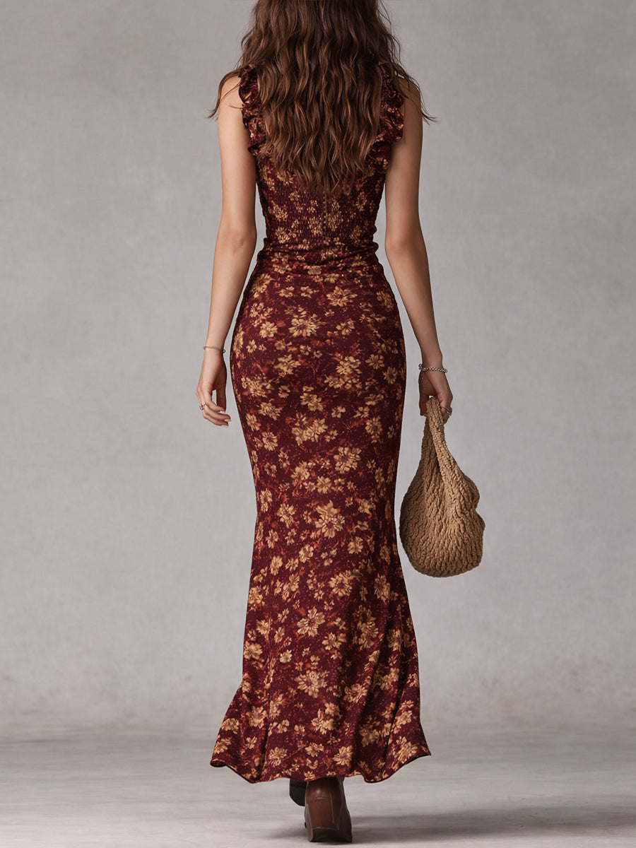 Vibrant women's floral summer maxi dress, bohemian inspired, with ruffled sleeves & a fashionable slit.