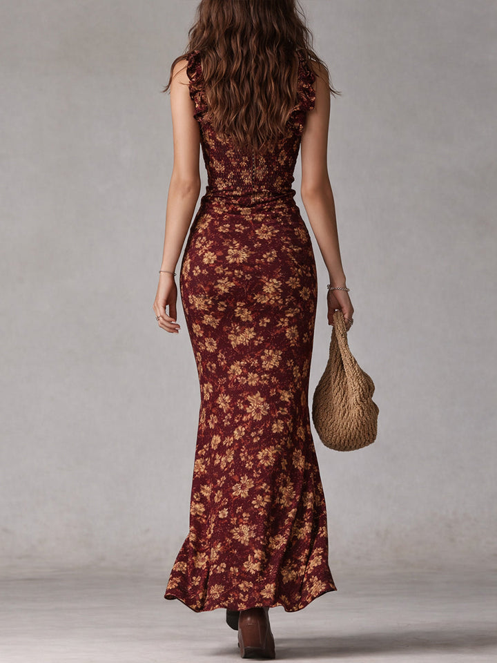 Vibrant women's floral summer maxi dress, bohemian inspired, with ruffled sleeves & a fashionable slit.