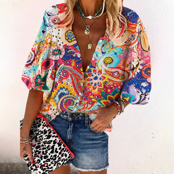 Trendy women's floral print V-neck top with short sleeves. Ideal for bohemian summer outfits & vacation wear.