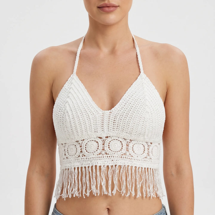 Stylish crochet halter crop top with fringe and open back, ideal for festivals.