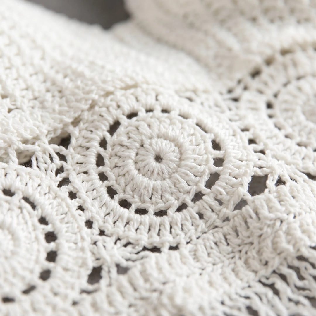 Sleeveless women's fringe crop top, a chic crochet halter for summer vacations.