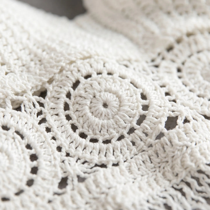 Sleeveless women's fringe crop top, a chic crochet halter for summer vacations.