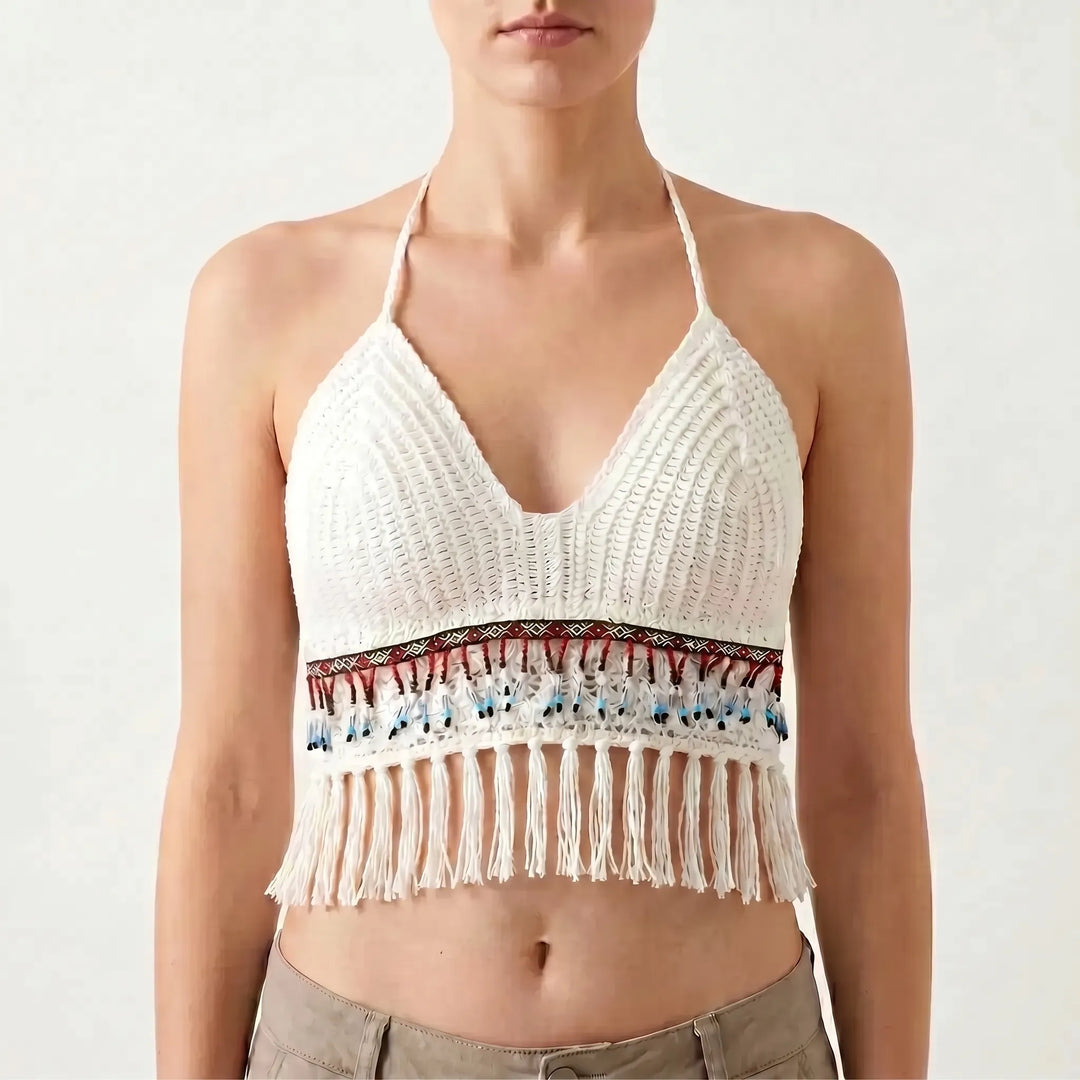 Bohemian-style women's crochet halter crop top with playful fringe detail.