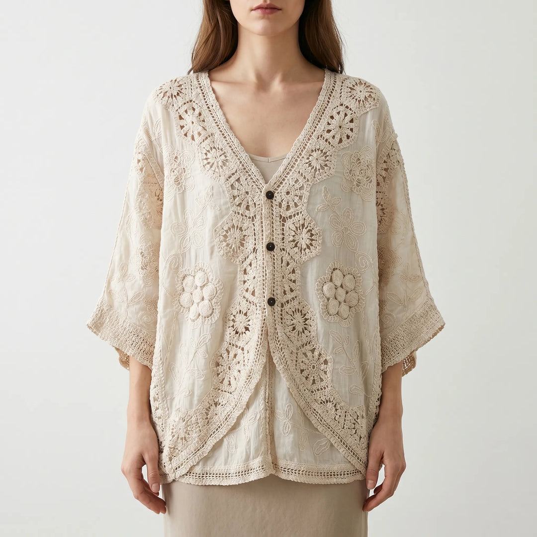 Loose fit women's bohemian textured knit cardigan, a lightweight cream summer top with three-quarter sleeves and V-neck.