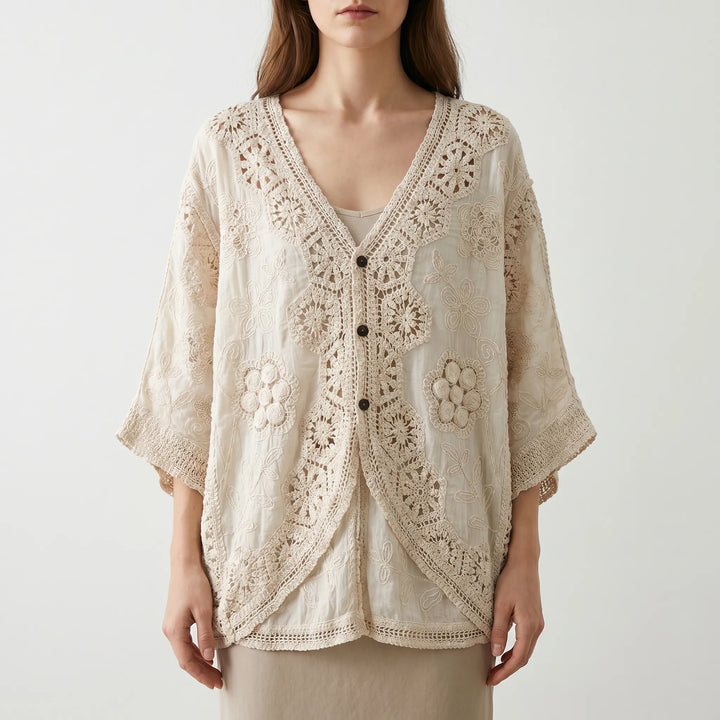 Loose fit women's bohemian textured knit cardigan, a lightweight cream summer top with three-quarter sleeves and V-neck.