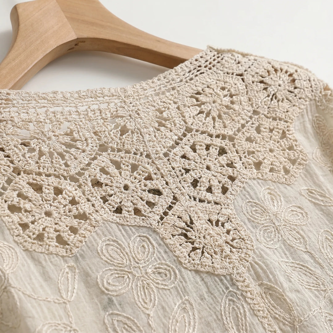 Lightweight cream bohemian women's cardigan, a loose-fit summer knit and beachwear layer with three-quarter sleeves.