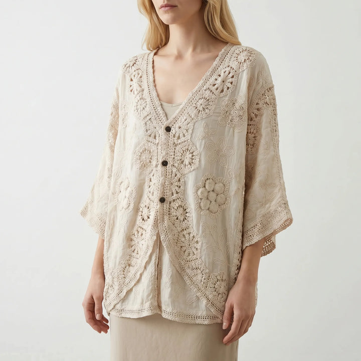Cream bohemian women's cardigan featuring a V-neck, three-quarter sleeves, and a lightweight textured knit for summer.
