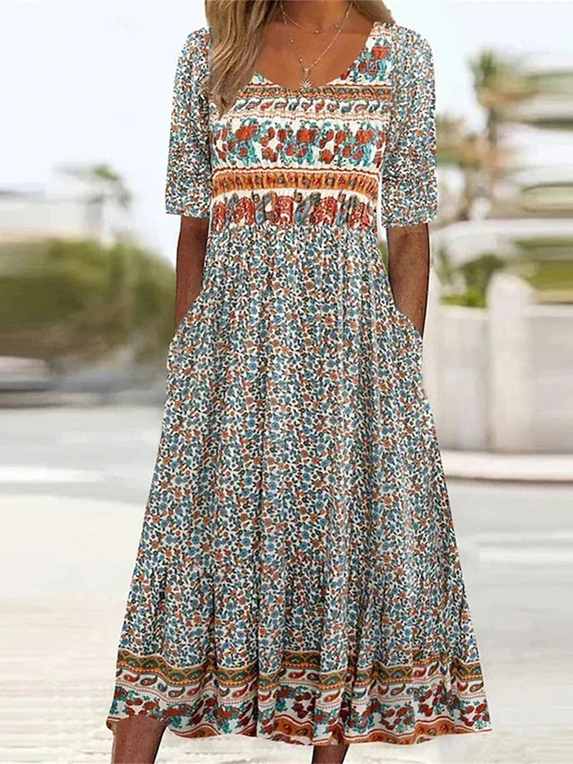Women's Bohemian print midi dress with short sleeves, round neck, and practical pockets. Ideal casual summer/fall fashion.