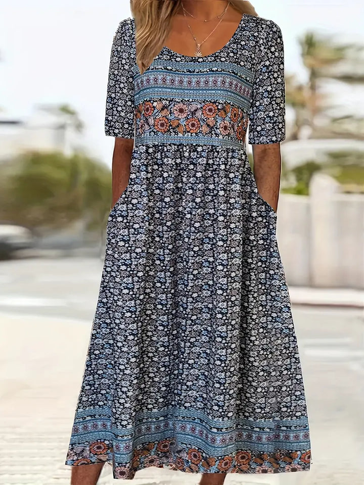 Stylish women's boho print midi dress, featuring a comfortable round neck, short sleeves, and handy side pockets.