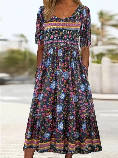 Everyday wear women's boho midi dress. Vibrant print, short sleeves, round neck, and convenient pockets for casual style.