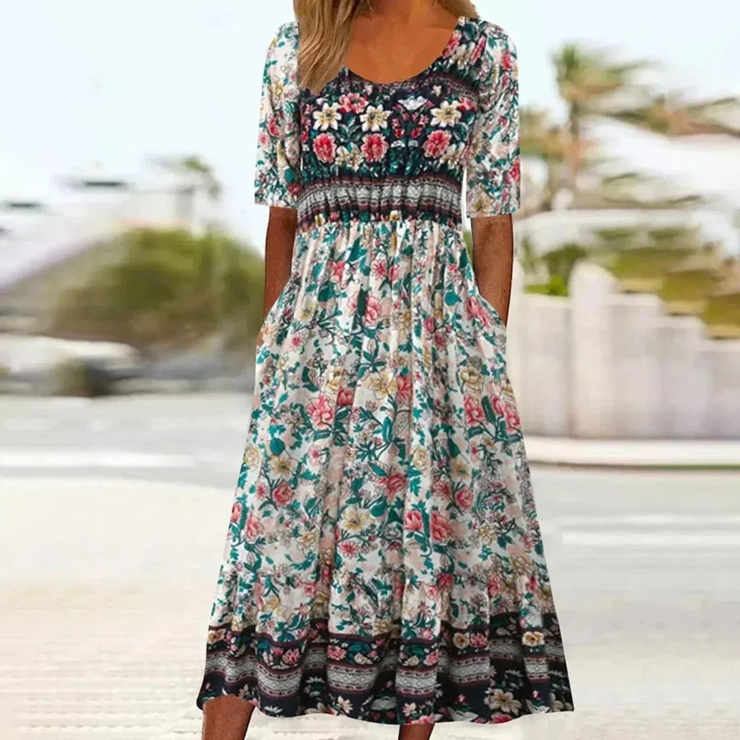 Chic women's bohemian print midi dress. Flattering round neck, short sleeves, and essential pockets for versatile fall/summer.