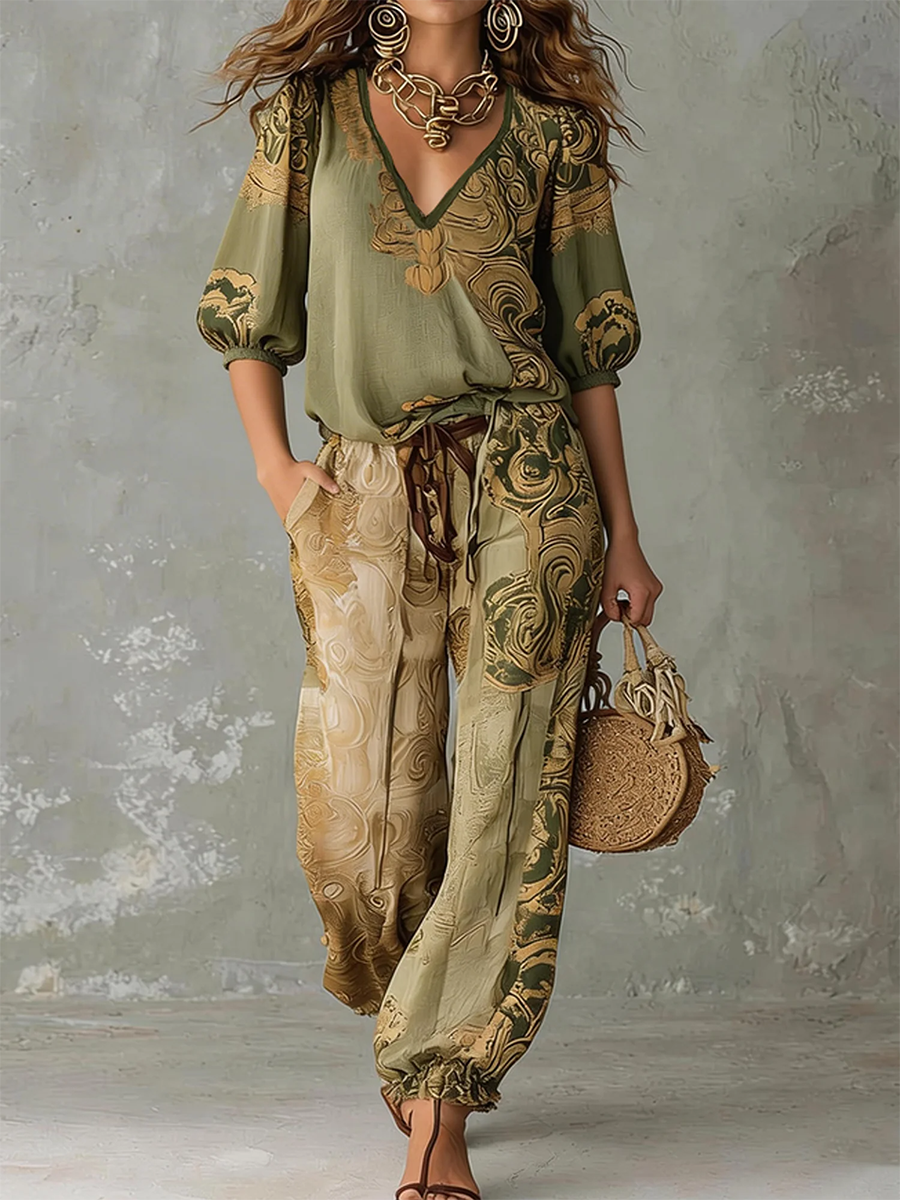 Close-up of vibrant bohemian print on a women's V-neck top and comfortable pants set, perfect for summer.