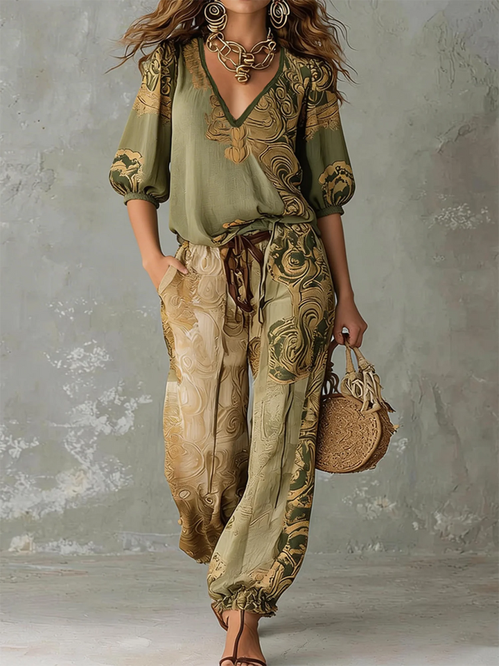 Close-up of vibrant bohemian print on a women's V-neck top and comfortable pants set, perfect for summer.