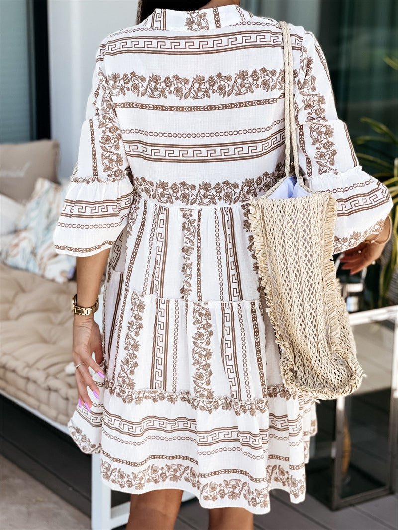 Boho print women's tiered mini dress, featuring airy flare sleeves, a perfect lightweight summer outfit.